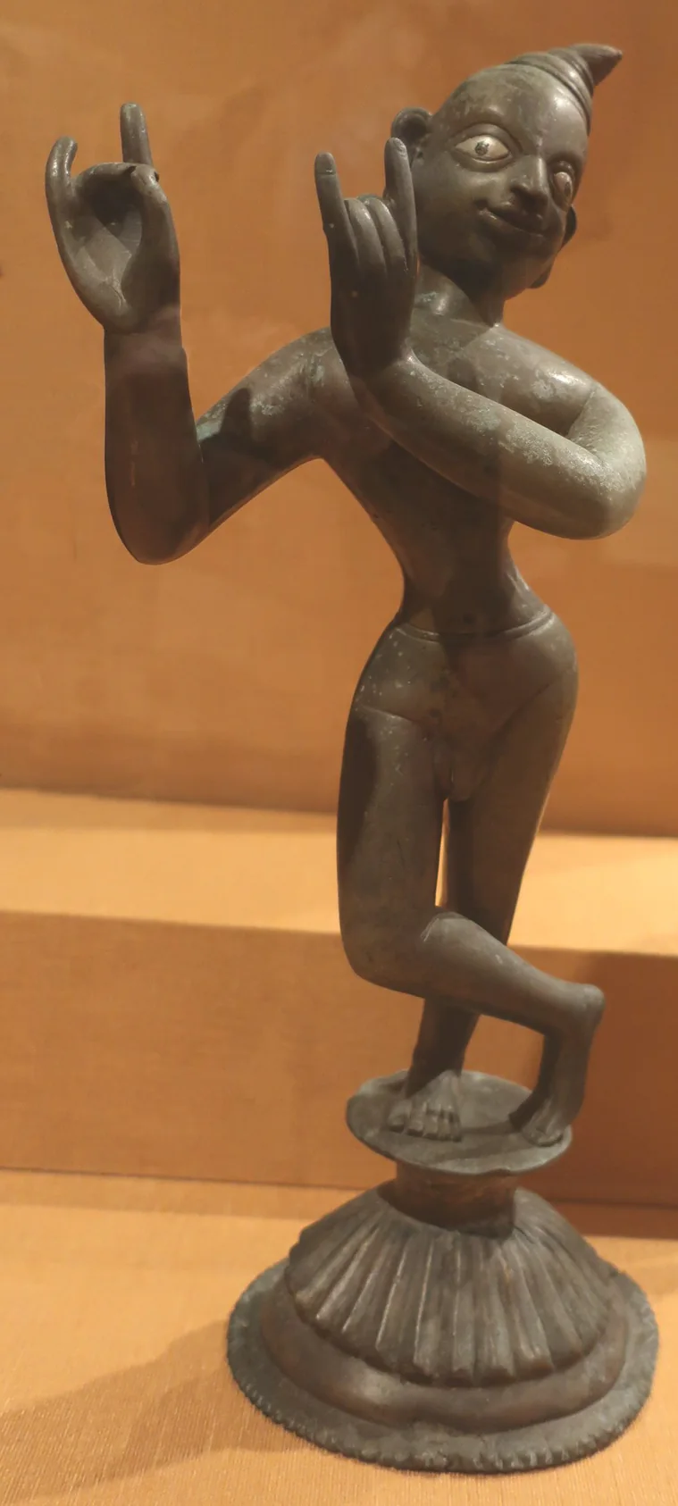 Editorial reference photograph of a historic bronze Krishna sculpture; not the listed product.